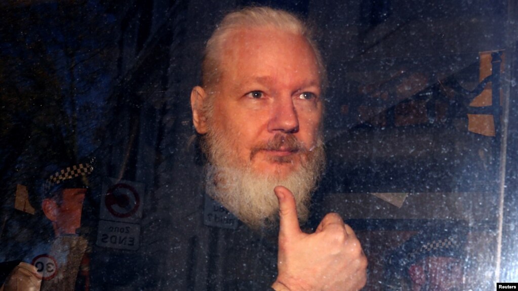 WikiLeaks founder Julian Assange arrives at the Westminster Magistrates Court, after he was arrested in London, Britain, April 11, 2019. 