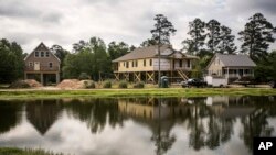 New homes are built on pillars along the Little Pee Dee River, in Nichols, S.C., May 13, 2019. Nichols suffered devastating flooding during Hurricane Matthew 2016 and Florence in 2018.
