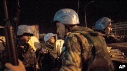 UN peacekeepers from Jordan provide security at night on the streets of Abidjan, Ivory Coast, April 4, 2011