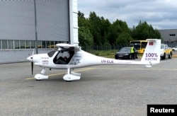 A two-seat electric plane made by Slovenian firm Pipistrel stands outside a hangar before a test flight at Oslo Airport, Norway, June 18, 2018.
