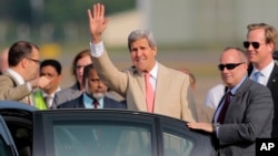 U.S. Secretary of State John Kerry waves to the media after his arrival at Bandaranaike International Airport in Colombo, Sri Lanka, Saturday, May 2, 2015. 