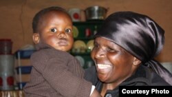 The proud granny with the boy she saved, her grandson, Luphumlo (Photo:D.Taylor)