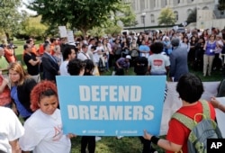 FILE - Immigrant rights supporters gather at the U.S. Capitol in Washington, Sept. 26, 2017.