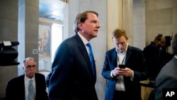 FILE - Former White House counsel Don McGahn arrives for a ceremony in the Great Hall at the Department of Justice in Washington, May 9, 2019. 