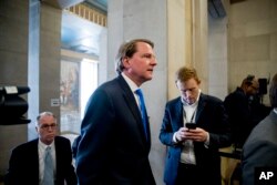 FILE - Former White House Counsel Don McGahn arrives for a farewell ceremony for Deputy Attorney General Rod Rosenstein in the Great Hall at the Department of Justice in Washington, May 9, 2019.