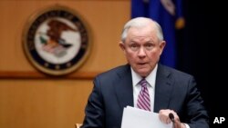 FILE - U.S. Attorney General Jeff Sessions prepares to speak before a meeting at the Department of Justice in Washington, April 18, 2017. 