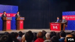 (L to R) Candidates Penpa Tsering and Lobsang Sangay with moderators Tenzin Sangmo and Namgyal Shastri.