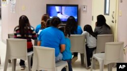 FILE - This photo provided by U.S. Immigration and Customs Enforcement shows a scene from a tour of South Texas Family Residential Center in Dilley, Texas, Aug. 9, 2018. 