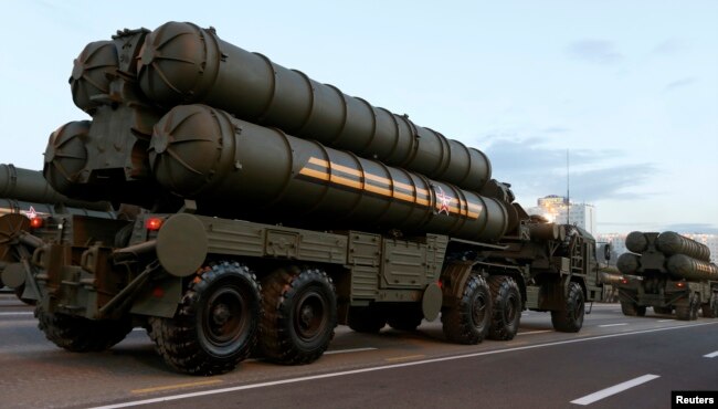 FILE - Russian S-400 air defense mobile missile launching systems take part in a military parade in Minsk, July 3, 2014.