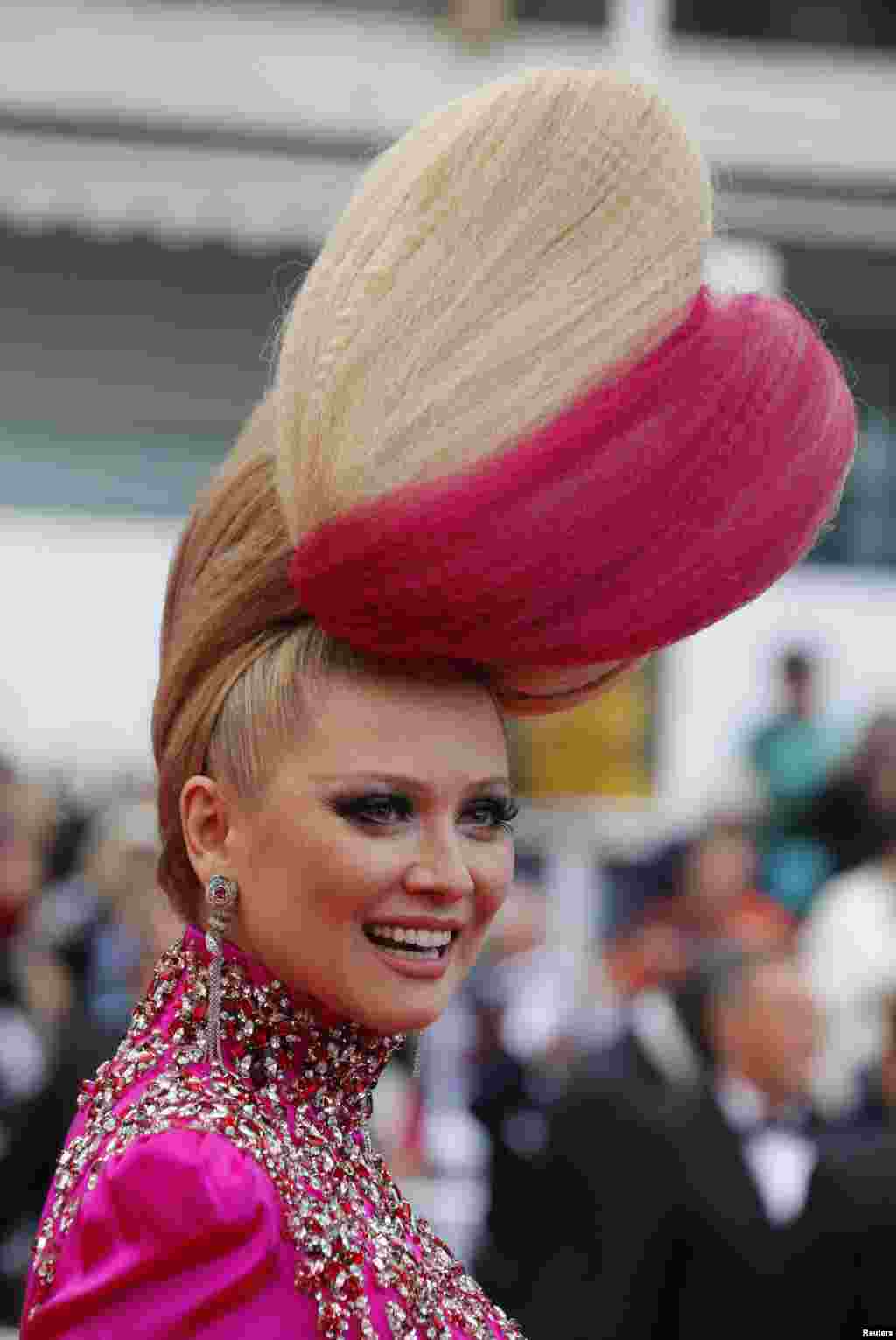 TV personality Elena Lenina poses on the red carpet as she arrives for the screening of the film &quot;Ma loute&quot; (Slack Bay) in competition at the 69th Cannes Film Festival in Cannes, France.