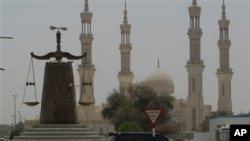 Justice monument in front of a mosque in Ras al Khaimah, United Arab Emirates, May 3, 2012.