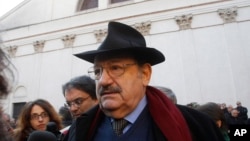 Italian writer Umberto Eco attends the funeral of Italian writer and journalist Giorgio Bocca, at the San Vittore al Corpo church, in Milan, Italy, Tuesday, Dec. 27, 2011. Eco died Friday in Milan at age 84.