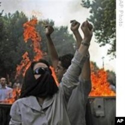 Pink says people, like these Iranian protesters in July 2009, follow a natural instinct to resist control and direct their own lives.