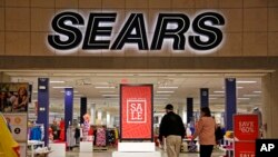 In this Feb. 8, 2017, photo, shoppers walk into a Sears store in Pittsburgh. 