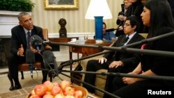 FILE - US President Barack Obama meets with a group of "dreamers" who have received Deferred Action for Childhood Arrivals (DACA) at the White House in Washington, Feb. 4, 2015.