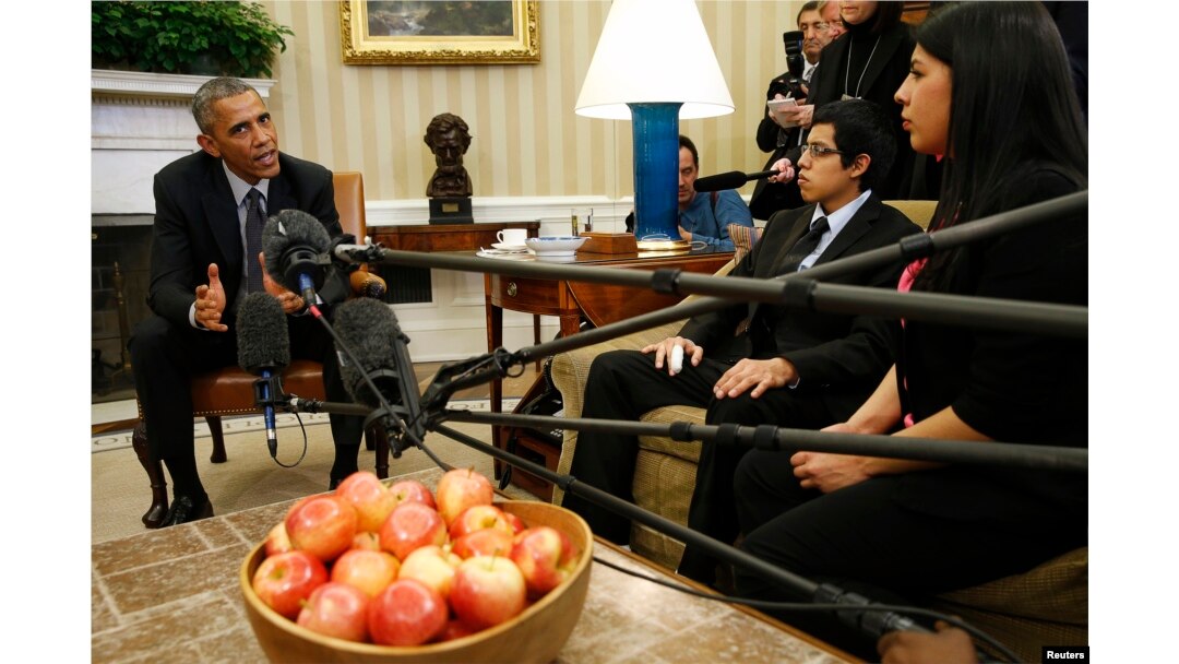 FILE - Then-President Barack Obama meets with a group of "Dreamers" affected by the Deferred Action for Childhood Arrivals program at the White House in Washington, Feb. 4, 2015.