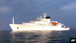 In this undated photo released by the U.S. Navy Visual News Service, the USNS Bowditch, an civilian oceanographic survey ship, sails in open water. The Bowditch was recovering two drones last Thursday when a Chinese navy ship approached and sent out a small boat that took one of the drones, a Pentagon spokesman said.