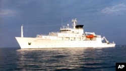 FILE - In this undated photo released by the U.S. Navy Visual News Service, the USNS Bowditch, an civilian oceanographic survey ship, sails in open water. The Bowditch was recovering two drones Thursday when a Chinese navy ship approached and sent out a small boat that took one of the drones, a Pentagon spokesman said.