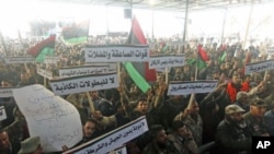 Members of the Libyan National Army rally to call for the National Transitional Council to stop marginalizing the role of the national army in Benghazi, Libya, March 4, 2012. 