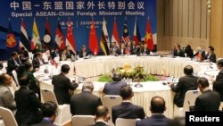 China's Foreign Minister Wang Yi (C) speaks during the Special ASEAN-China Foreign Ministers' Meeting in Yuxi, Yunnan Province, China, June 14, 2016