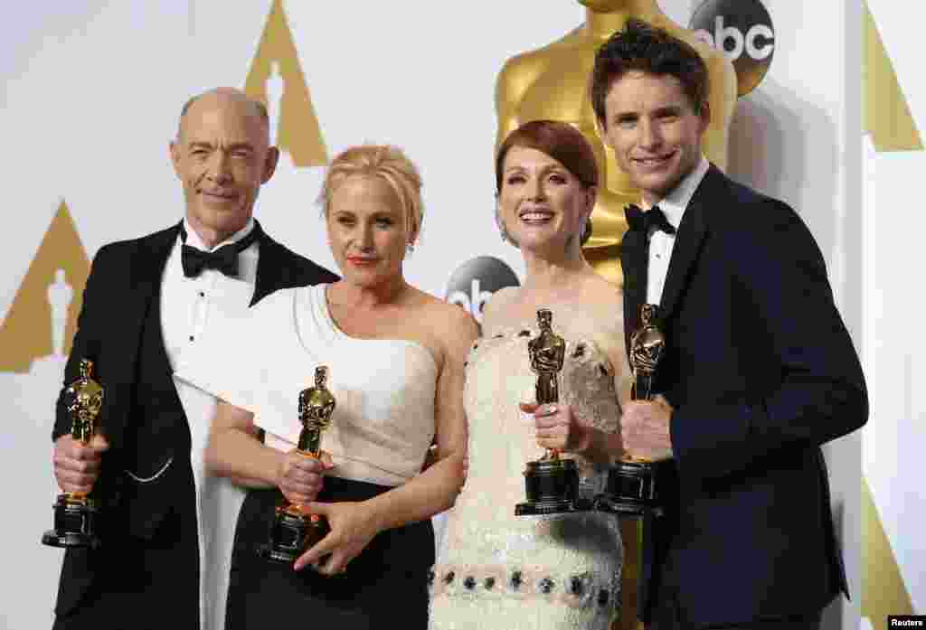 J.K. Simmons (L), best supporting actor for &quot;Whiplash, Patricia Arquette (2nd L), best supporting actress for &quot;Boyhood&quot;, Julianne Moore (3rd L), best actress for &quot;Still Alice&quot; and Eddie Redmayne, best actor for &quot;The Theory of Everything&quot; pose with their Oscars backstage at the 87th Academy Awards in Hollywood, California, Feb. 22, 2015.