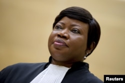 Prosecutor Fatou Bensouda waits for former Congo vice-president Jean-Pierre Bemba to enter the courtroom of the International Criminal Court to stand trial, in The Hague, Sept. 29, 2015.