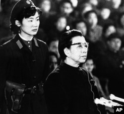 FILE - Jiang Qing, defiant widow of Chairman Mao Tse-tung, appears before session of the special tribunal of the Supreme People's Court in Peking on Friday, Dec. 5, 1980.