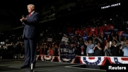 Republican U.S. presidential nominee Donald Trump arrives on stage at a campaign rally in Wilkes-Barre, Pennsylvania, Oct. 10, 2016. 