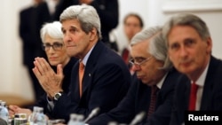 U.S. Secretary of State John Kerry meets with foreign ministers of Germany, France, China, Britain, Russia and the European Union during the Iran talks meetings at a hotel in Vienna, Austria, July 7, 2015.