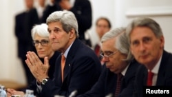 U.S. Secretary of State John Kerry meets with foreign ministers of Germany, France, China, Britain, Russia and the European Union during the Iran talks meetings at a hotel in Vienna, Austria, July 7, 2015.