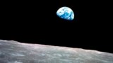 FILE - This Dec. 24, 1968, photo made available by NASA shows the Earth behind the surface of the moon during the Apollo 8 mission.