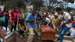 VENEZUELA – Relatives and friends attend the burial of Johander Perez and Wuilkerman Ruiz, at the General South Cementery in Caracas, Venezuela, on November 5, 2019. Perez and Ruiz were allegedly killed by the Bolivarian National Police’s Special Action Forces (FAES) on Nov. 1, 2019.