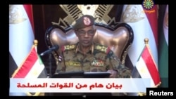 Sudan's Defense Minister Awad Mohamed Ahmed Ibn Auf makes an announcement in this still image taken from video, April 11, 2019, that President Omar al-Bashir had been detained "in a safe place" and that a military council would run the country for a two-year transitional period. 