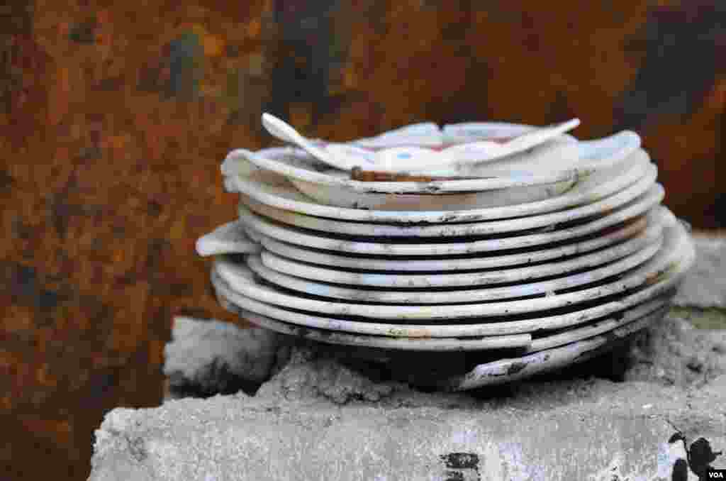 A stack of damaged plates still sits on a pillar in one of the buildings shelled by North Korea. (Photo: VOA / Steve Herman)