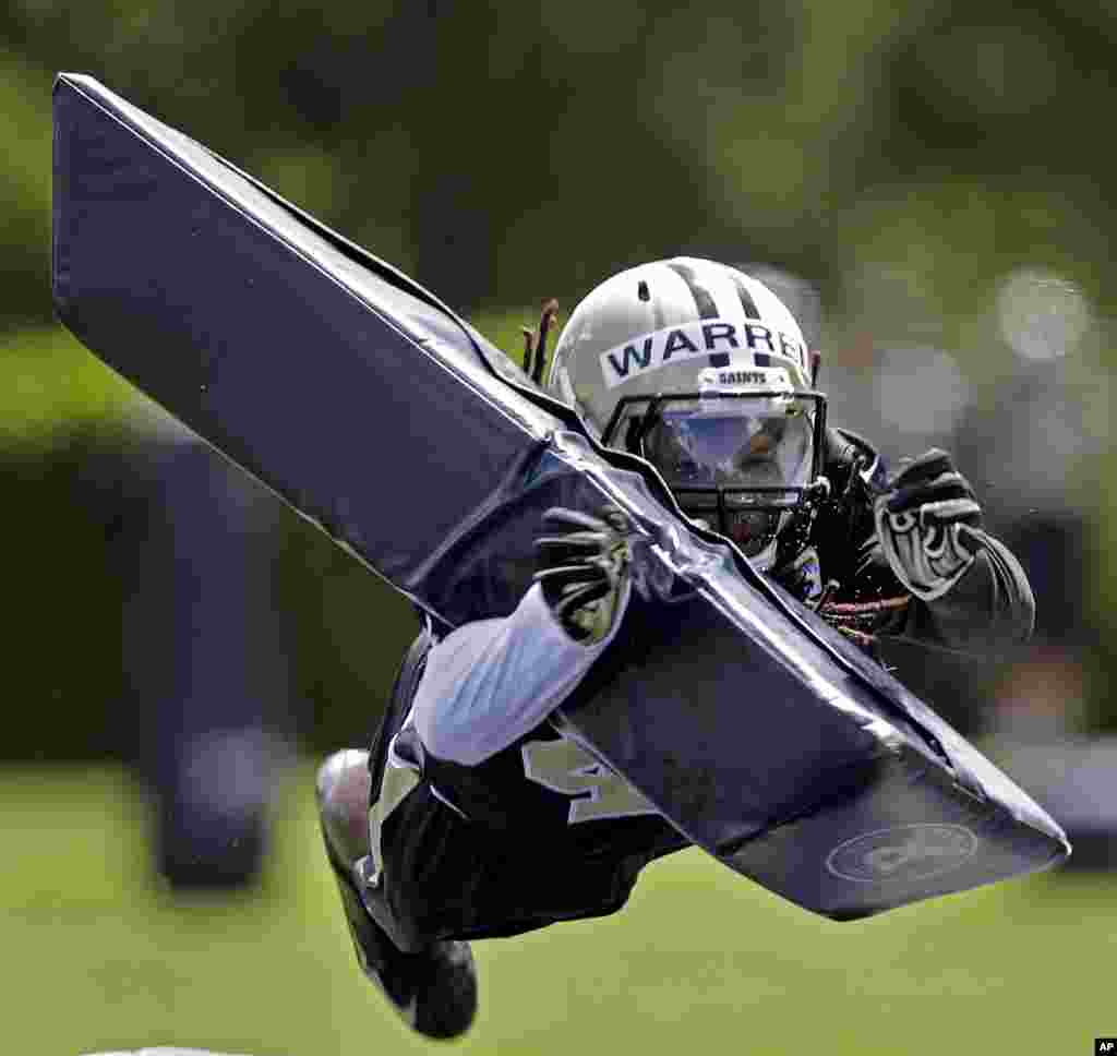 New Orleans Saints safety Pierre Warren hits a pylon during an NFL football organized team activity in Metairie, Louisana, USA..