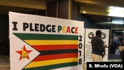 A "Peace Pledge" poster.