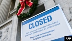 A sign is displayed at the National Archives building that is closed because of a U.S. government shutdown in Washington, Dec. 22, 2018.