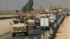 Konvoi kendaraan militer AS melintasi perbatasan ke wilayah semi-otonom Kurdistan di Irak, 21 Oktober 2019. 