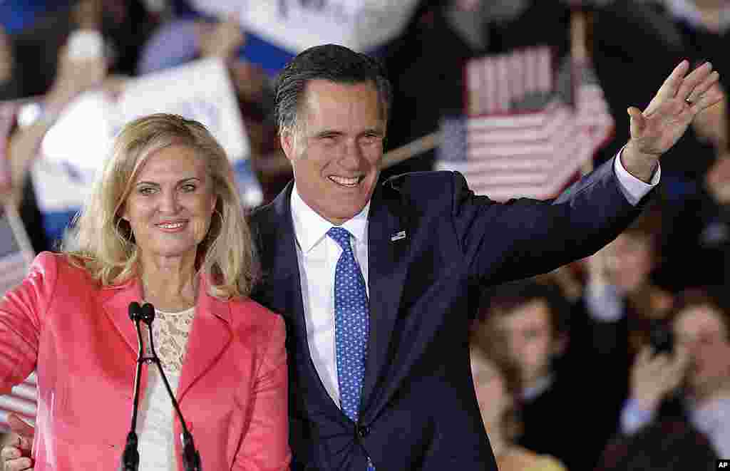 Republican presidential candidate Mitt Romney and his wife Ann wave to supporters at his Super Tuesday campaign rally in Boston, Massachusetts, March 6, 2012. (AP)