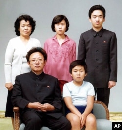 FILE - North Korean leader Kim Jong Il, front left, poses with his first-born son Kim Jong Nam, front right, and his relatives in Pyongyang in this Aug. 19, 1981 photo.