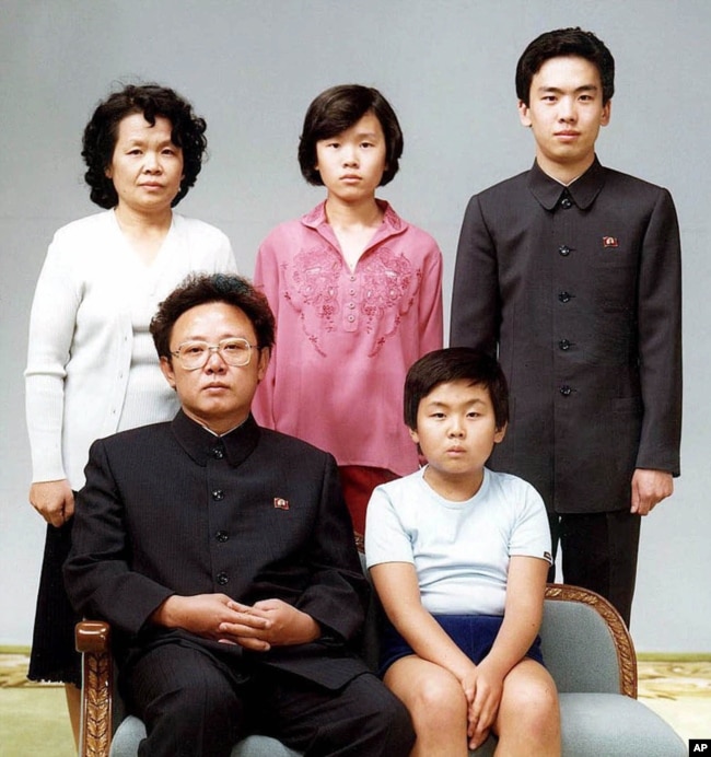 North Korean leader Kim Jong Il, front left, poses with his first-born son Kim Jong Nam, front right, and his relatives in Pyongyang in this Aug. 19, 1981 photo.