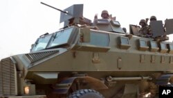 Uganda People's Defence Force troops ride through the streets of Bor, Jonglei State on January 19 during South Sudan's conflict.