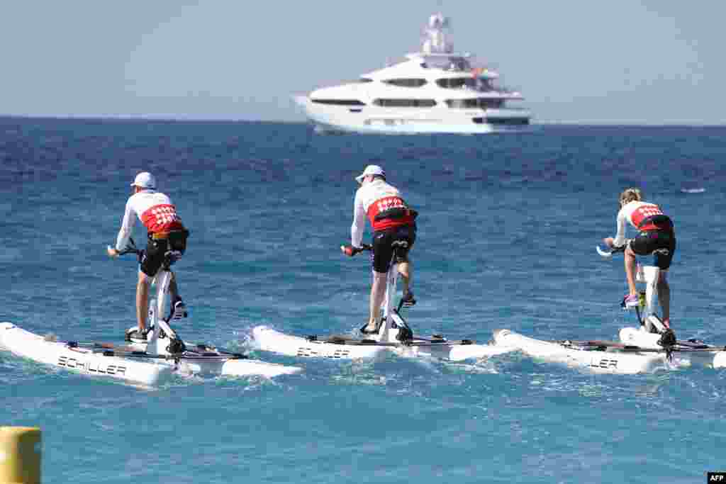 Prince Albert II of Monaco (C) competes in the first &quot;Riviera water bike challenge&quot;, a cycling race between Nice and Monaco, in Nice, southeastern France.