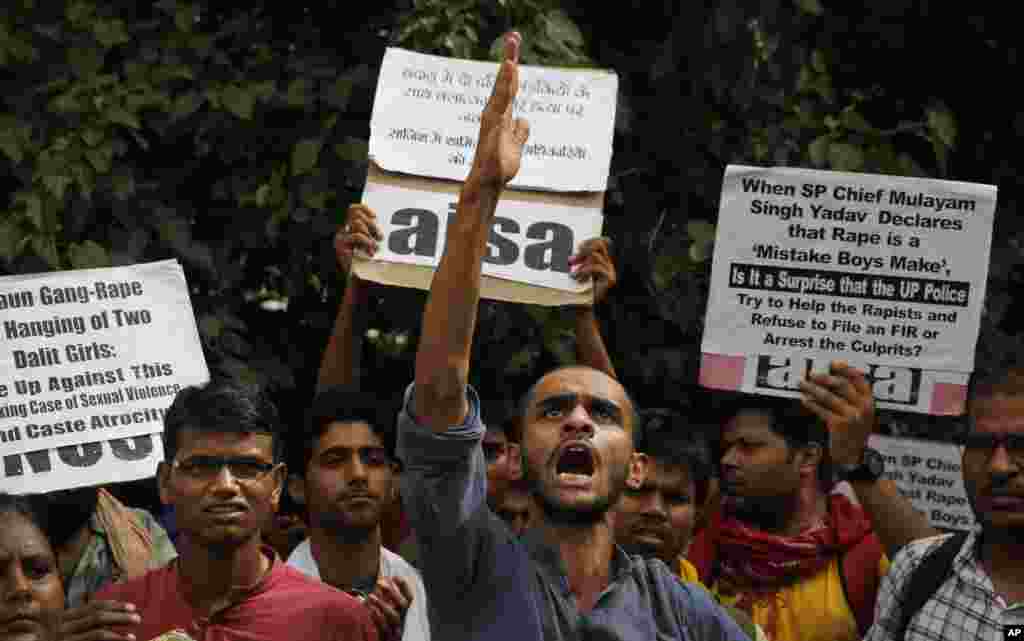 Members of Jawaharlal Nehru University Students Union shout slogans during a protest against a gang rape of two teenage girls in Katra village, outside the Uttar Pradesh state house, in New Delhi, India.