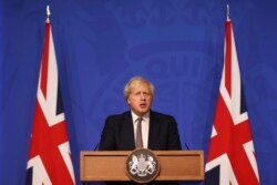 Britain's Prime Minister Boris Johnson during a media briefing on the COVID-19 pandemic, in Downing Street, London, Nov. 30, 2021.