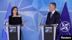UNHCR Special Envoy actor Angelina Jolie and NATO Secretary General Jens Stoltenberg hold a news conference at the Alliance's headquarters in Brussels, Belgium, Jan. 31, 2018. 