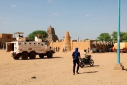 FILE - United Nation forces patrol the streets of Timbuktu, Mali, Sept. 26, 2021.