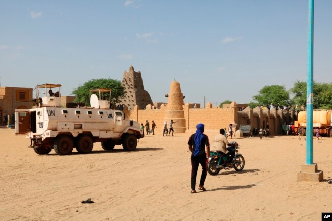 FILE - United Nation forces patrol the streets of Timbuktu, Mali, Sept. 26, 2021.