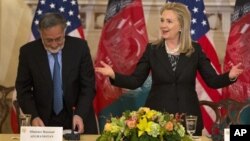 Secretary of State Hillary Rodham Clinton,accompanied by Afghan Foreign Minister Zalmai Rassoul, speaks at the U.S. Afghanistan Bilateral Commission, Wednesday, Oct. 3, 2012 , at the State Department in Washington.