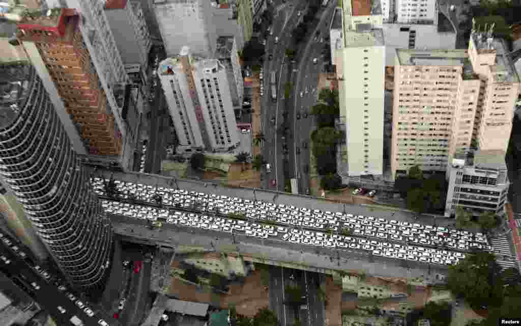 Taxis are seen parked on the street during a protest against the online car-sharing service Uber, in downtown Sao Paulo, Brazil, Sept. 9, 2015.